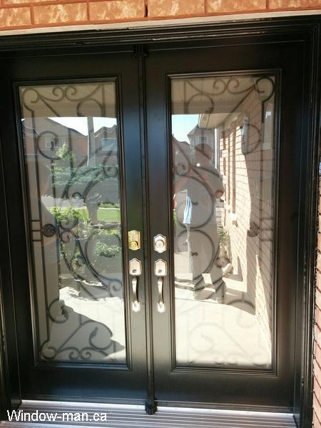 Double exterior doors front entry insulated steel. Black. Traditional Rochester wrought iron glass inserts